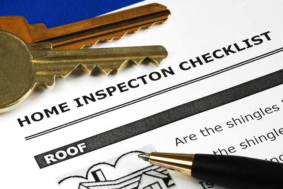 Top corner of a Home Inspection Checklist with house keys and a pen.